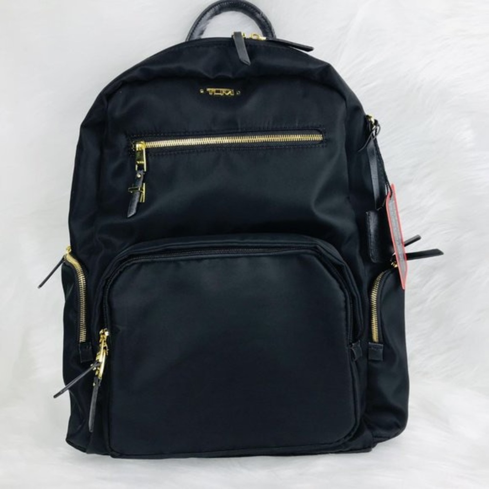 Tumi Black Backpack with Gold Details